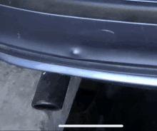 a close up of a car 's bumper with a small bump on it