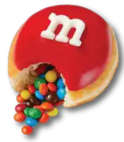 a m & m donut with a bite taken out of it and m & m 's pouring out of it