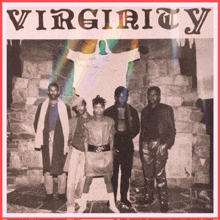 a group of people standing in front of a brick wall with the word virginity on it