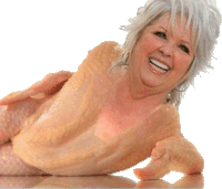 a naked woman is laying down and smiling with her arms outstretched