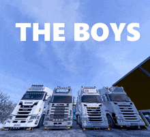 a group of scania trucks are parked next to each other with the words the boys written above them