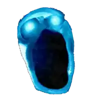 a blue object with glowing eyes and a black background