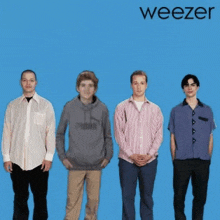 four men standing next to each other on a blue background with the word weezer on it