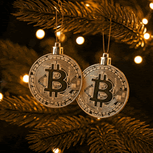 two christmas ornaments with the letter b on them hanging from a christmas tree