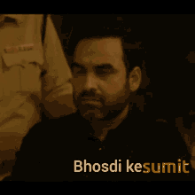 a man with a beard and the word bhosdi kesumit on the bottom right