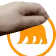 a close up of a hand holding an orange circle with an elephant in it .