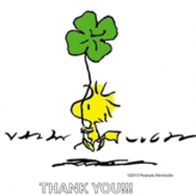 a cartoon of woodstock holding a green clover with the words thank you written below it