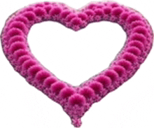 a pink heart made of purple flowers on a white background