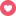 a pink circle with a heart in the middle of it .