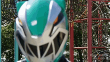 a person wearing a power rangers helmet in a playground