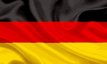 a close up of a german flag with black red and yellow