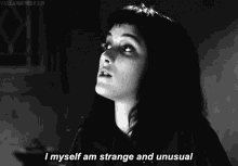 a black and white photo of a woman with the caption " i myself am strange and unusual "