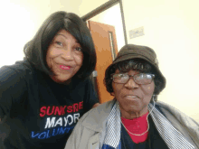 a woman wearing a shirt that says sunksre mayor volunteer