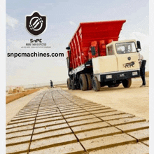 an advertisement for snpc machines shows a dump truck on a road