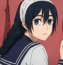 a girl with long black hair and blue eyes is wearing a sailor suit and a headband .