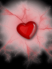 a red heart is surrounded by red lightning on a black background .