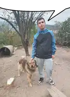 a man standing next to a dog with a speech bubble above him