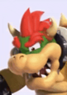 a close up of bowser 's head with a red mane .