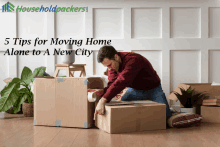 a man is wrapping a cardboard box with householdpackers written in the corner