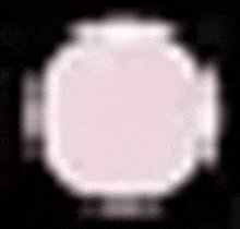 a white square on a black background with a blurred image of a circle .