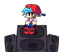 a cartoon character sitting on top of a speaker