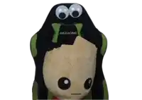 a black and green akracing gaming chair with a stuffed animal on it