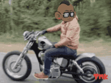 a man wearing sunglasses is riding a motorcycle with the letters tmk on the bottom