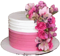 a pink and white cake decorated with pink roses and lilies