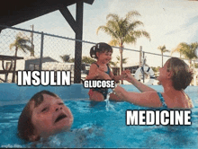 a woman is holding a little girl in a pool with the words insulin glucose and medicine written on the bottom