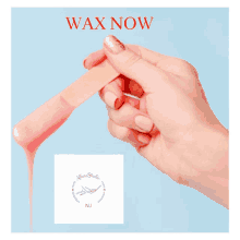 a woman 's hand holding a wax stick with the words " wax now " on the bottom