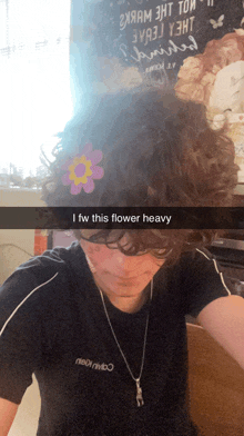 a person with a flower in their hair has a caption that says " i fw this flower heavy "