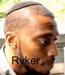 a man with the name ryker written on his face