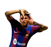 a soccer player wearing a spotify jersey making a face