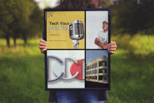 a person is holding a poster that says tech your business