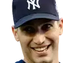 a man wearing a new york yankees hat smiles