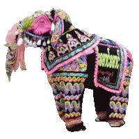 a colorful elephant with a black saddle that says myanmar on it