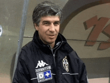 a man wearing a jacket that says juventus and d +