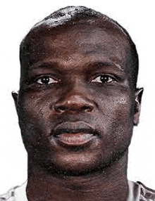 a close up of a man 's face with sweat coming out of his face on a white background .