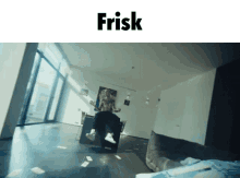 a man is sitting on a chair in a living room with the word frisk above him