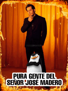 a man in a suit stands next to a penguin that says pura gente del senor jose madero on it