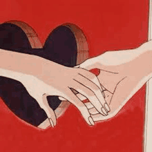 a couple of hands holding each other in front of a heart cut out of a red wall .