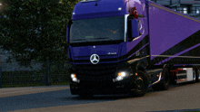 a purple mercedes truck is parked on a street