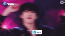 a close up of a person 's face with a vlive logo on the bottom