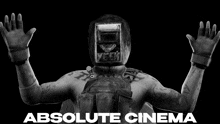 a black and white photo of a man wearing a welding helmet and gloves with the words absolute cinema below him