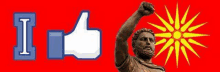 a statue of a man with his fist in the air next to a facebook thumbs up icon