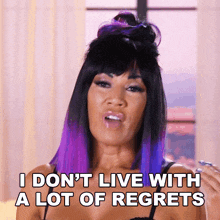 a woman with purple hair says i don t live with a lot of regrets