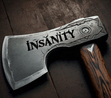 a large axe with the word insanity written on it