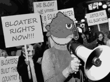 a man holding a megaphone and holding a sign that says we bloat we vote