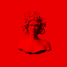 a red statue of medusa with snakes in her hair on a red background