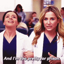 two female doctors standing next to each other with one saying and i 'm too pretty for prison